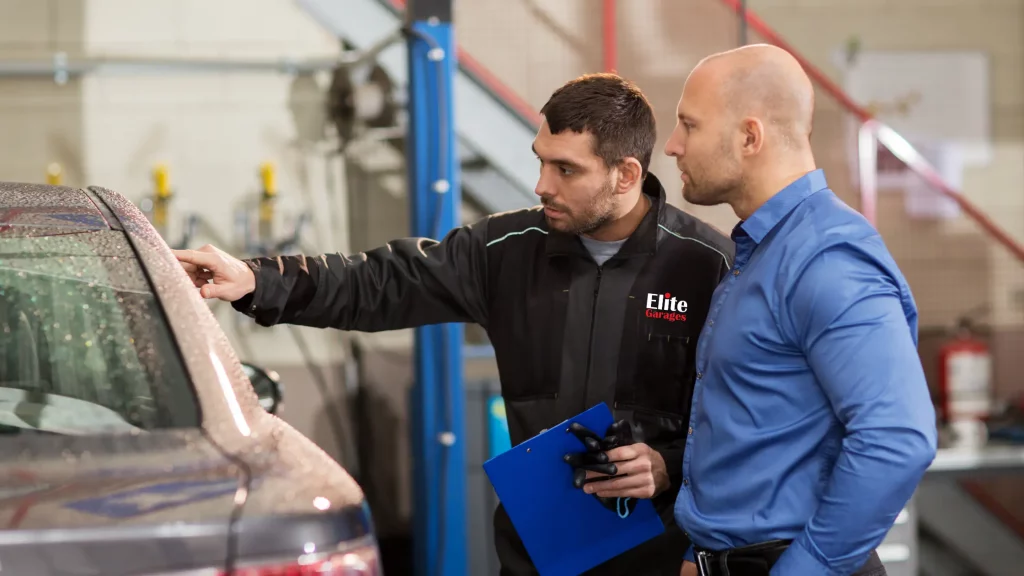 car mechanic showing a car repair