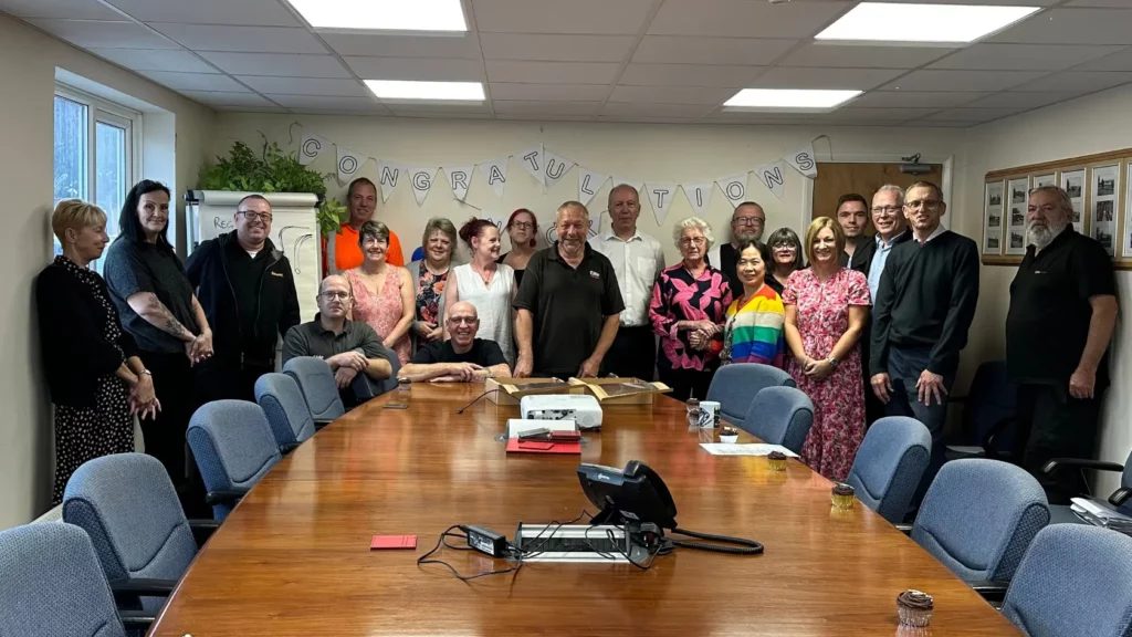 The Elite Garages team celebrating with Nick Barnes